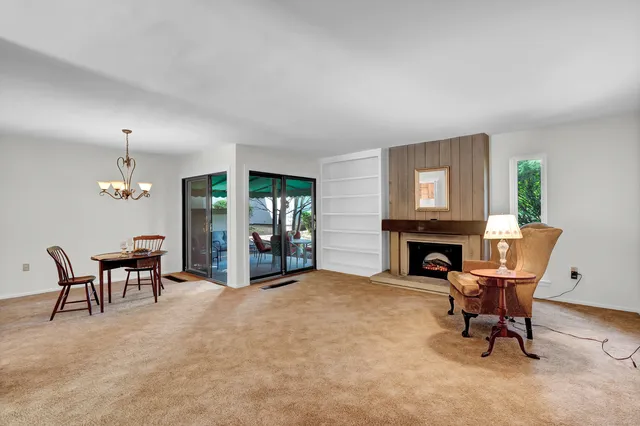 a patio with yard glass top table and chairs