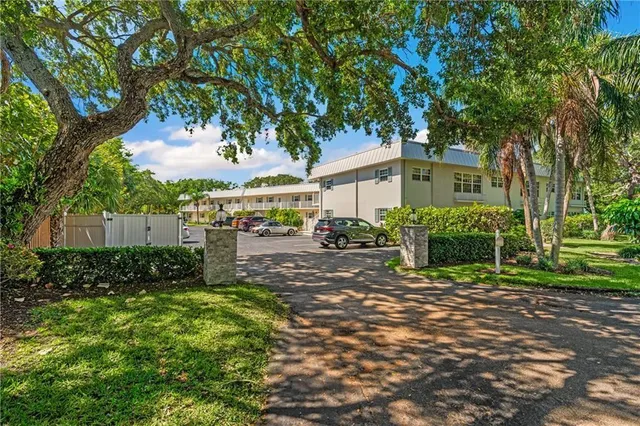 a view of a chairs and tables in the back yard of the house