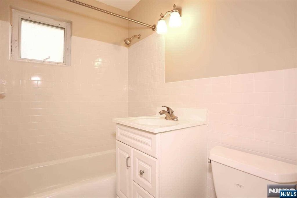712 Washington Drive, Unit 712 Ramsey, NJ 07446 - Photo 15 of 20 a bathroom with a sink a toilet and shower
