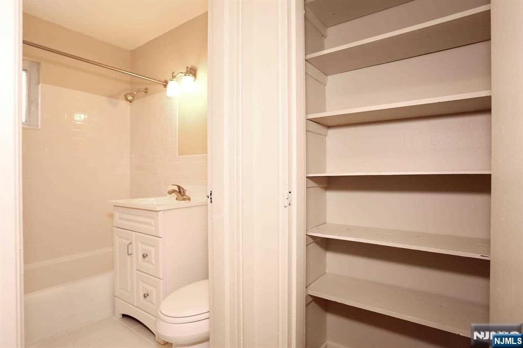 712 Washington Drive, Unit 712 Ramsey, NJ 07446 - Photo 17 of 20 a bathroom with a toilet and a shower