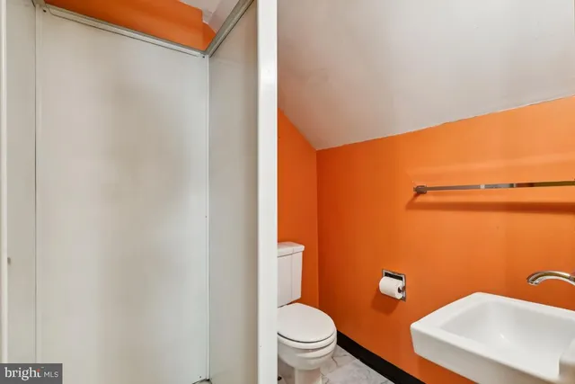 a bathroom with a toilet and a sink