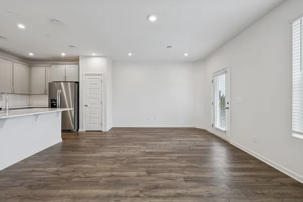 a view of kitchen with wooden floor
