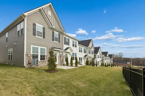 a view of a pathway with a yard