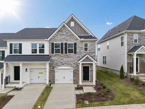 an aerial view of residential building with lake view