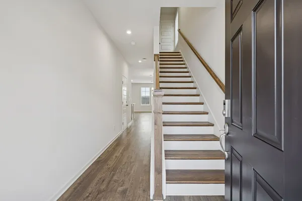 a kitchen with a sink and chandelier