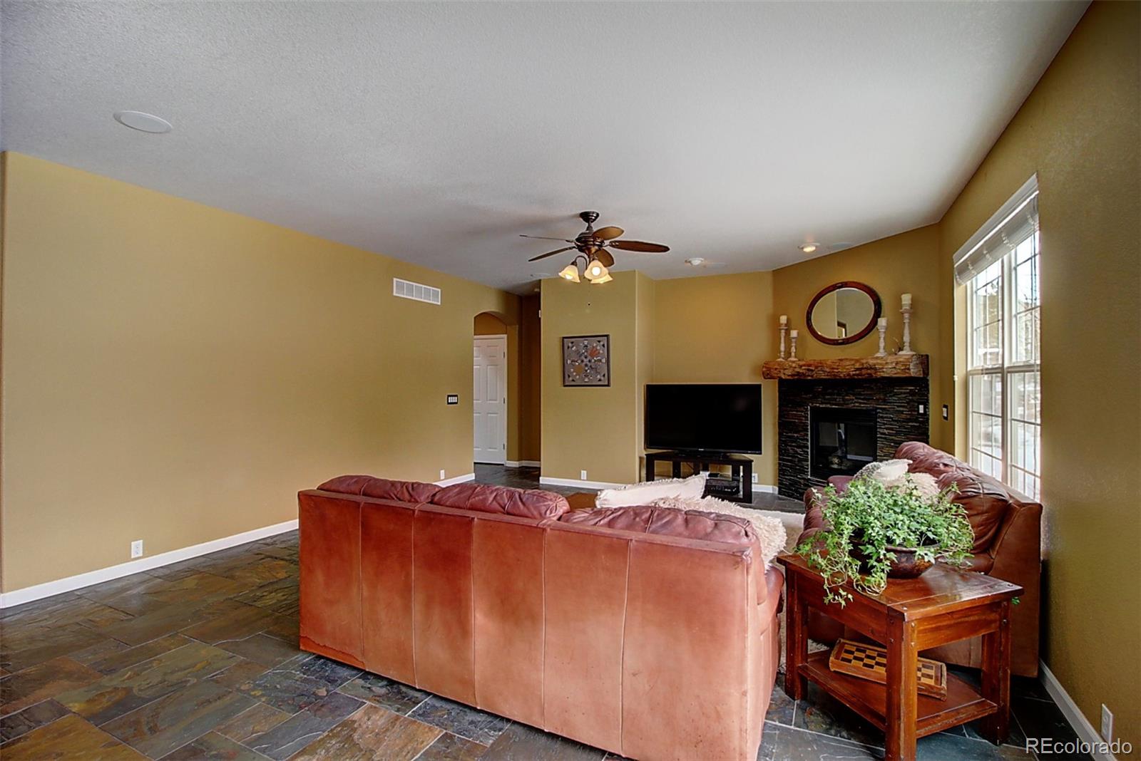 16330 Avalanche Run Broomfield, CO 80023 - Photo 12 of 39 a living room with furniture and a fireplace