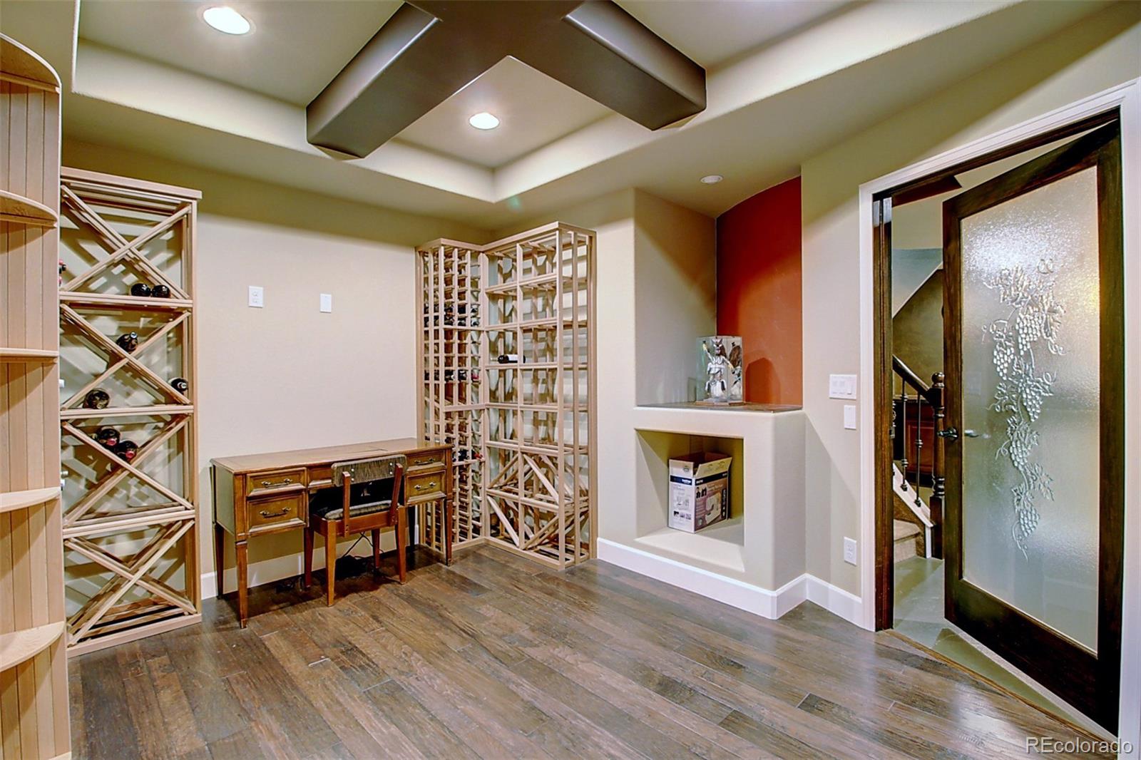 16330 Avalanche Run Broomfield, CO 80023 - Photo 20 of 39 a view of an empty room with a fireplace and wooden floor