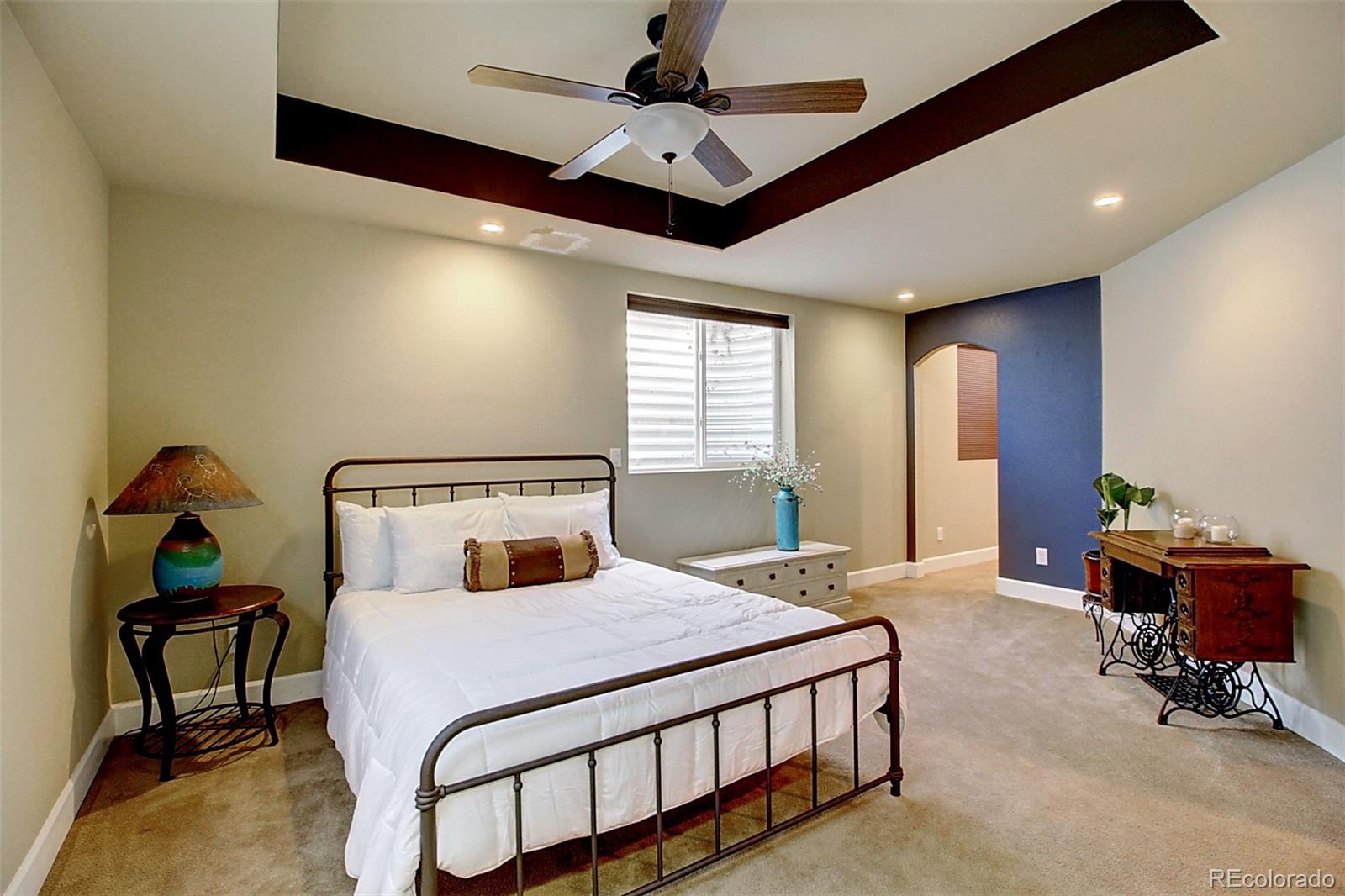 16330 Avalanche Run Broomfield, CO 80023 - Photo 23 of 39 a bedroom with a bed and wooden floor
