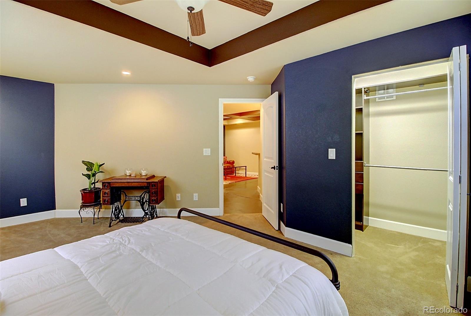 16330 Avalanche Run Broomfield, CO 80023 - Photo 24 of 39 a bedroom with a bed and a table in it