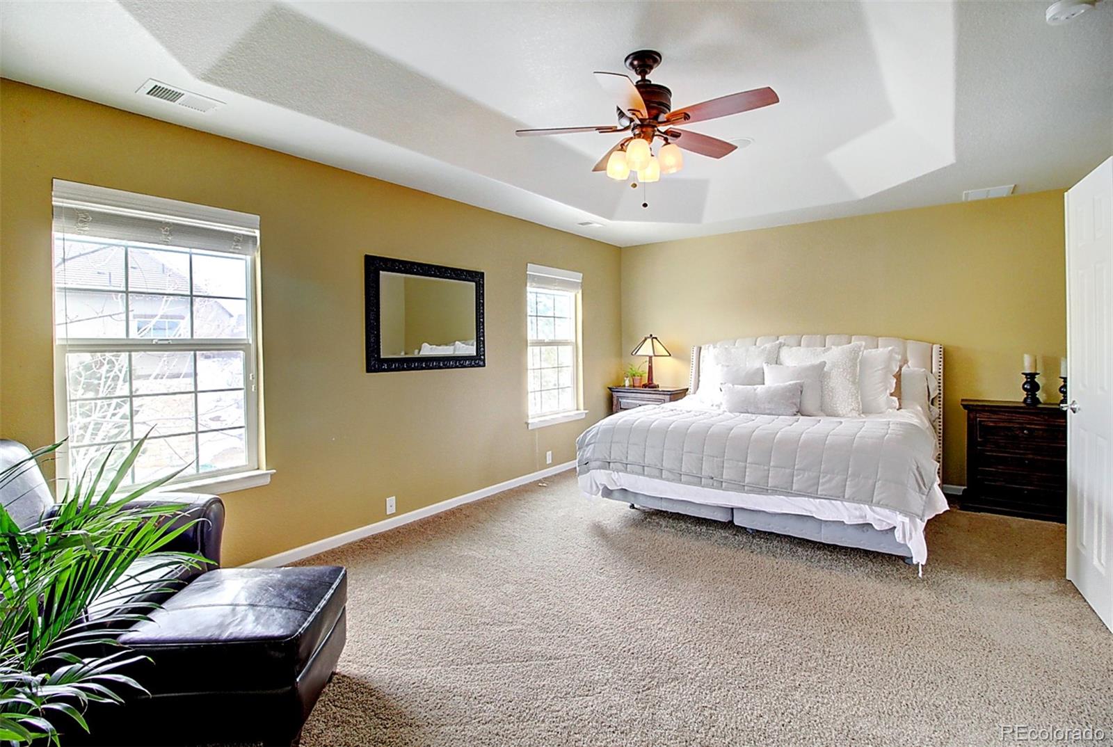 16330 Avalanche Run Broomfield, CO 80023 - Photo 29 of 39 a bedroom with a bed and wooden floor