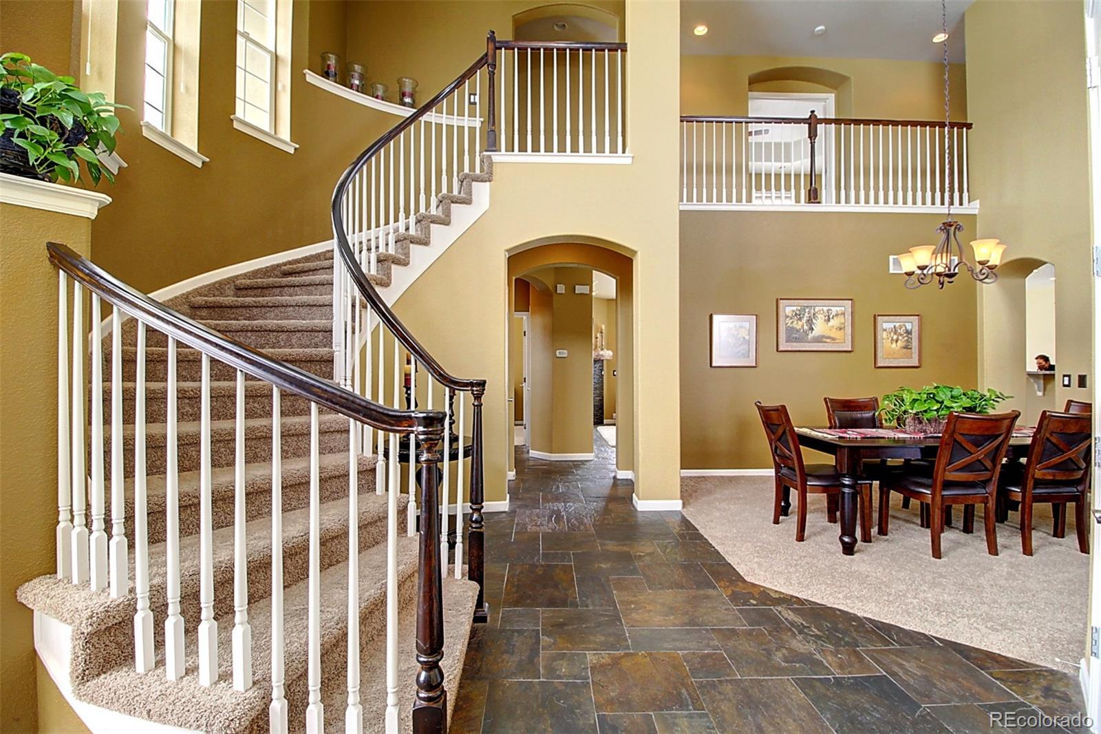 16330 Avalanche Run Broomfield, CO 80023 - Photo 3 of 39 a view of a dining room with furniture and chandelier
