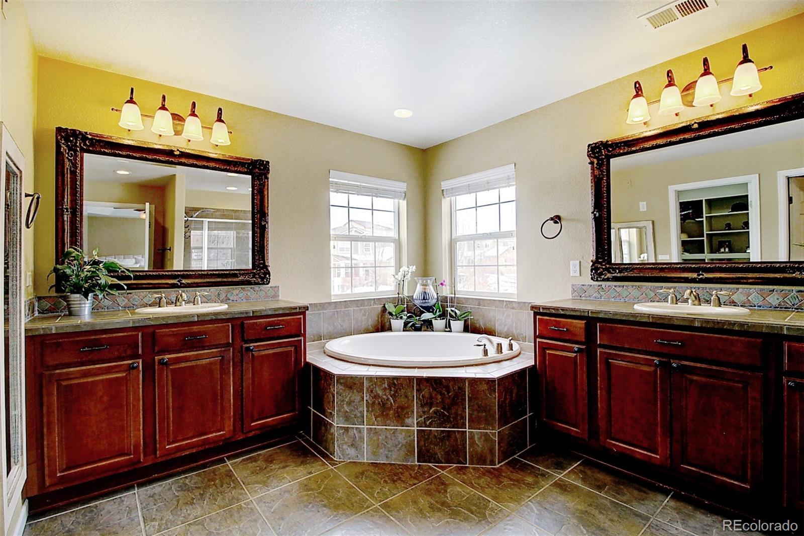 16330 Avalanche Run Broomfield, CO 80023 - Photo 32 of 39 a bathroom with a sink and a mirror
