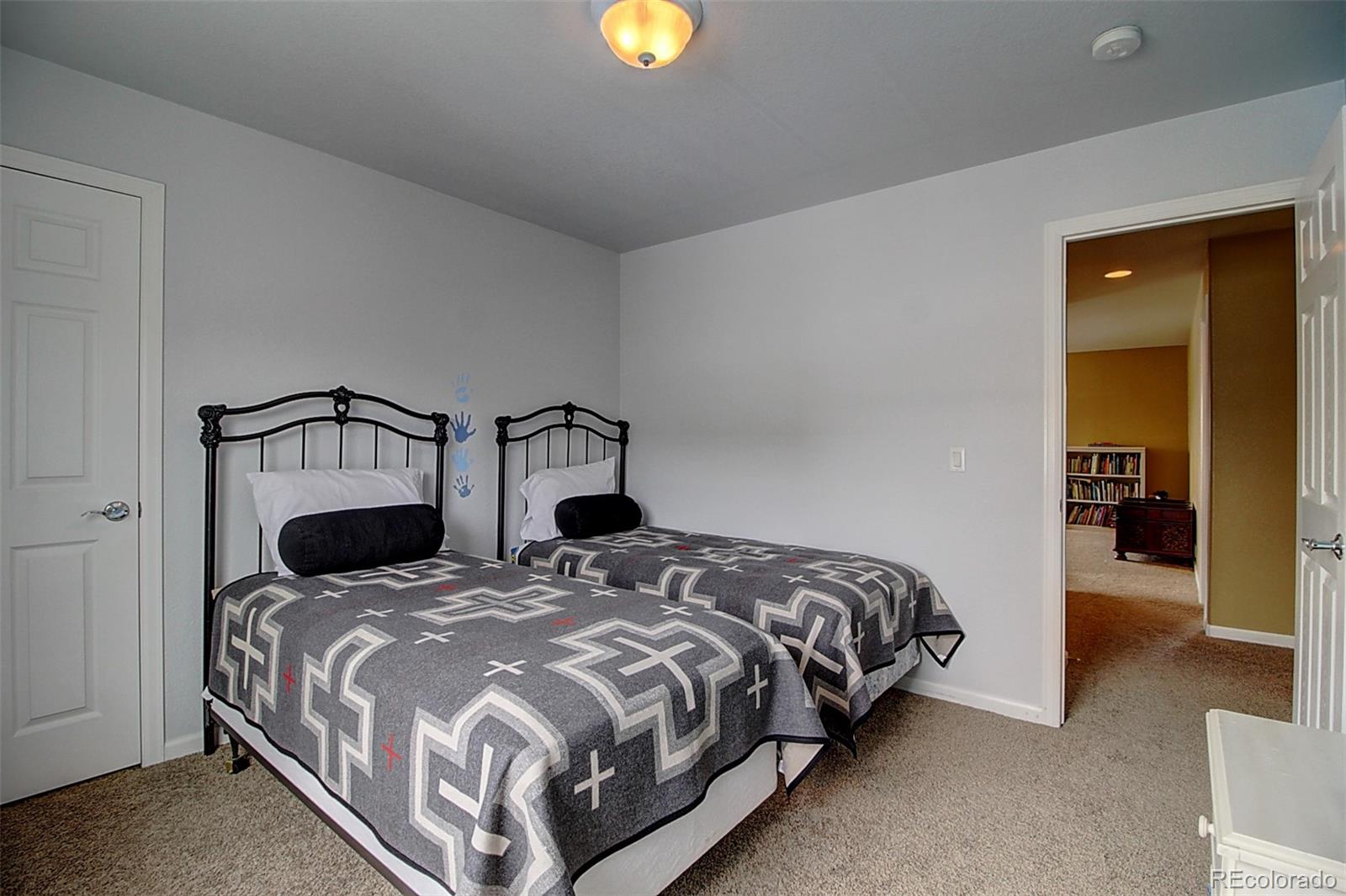 16330 Avalanche Run Broomfield, CO 80023 - Photo 34 of 39 a bedroom with two beds and painting on the wall