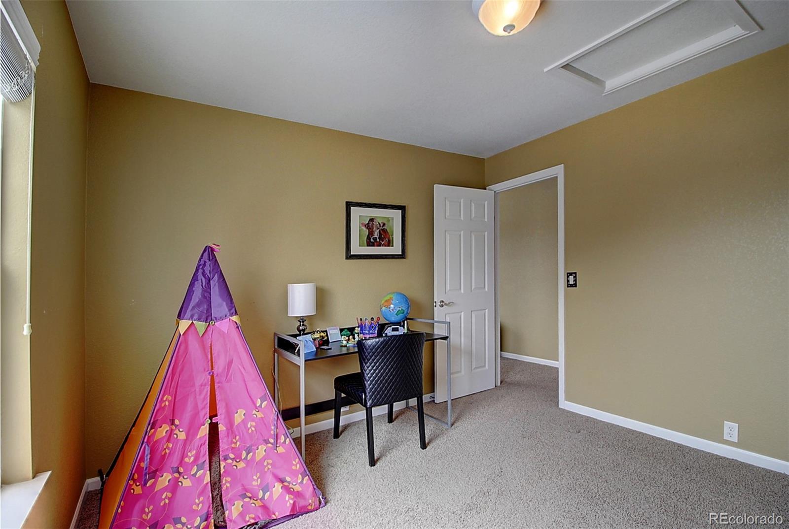 16330 Avalanche Run Broomfield, CO 80023 - Photo 37 of 39 a view of a living room with furniture and a workspace