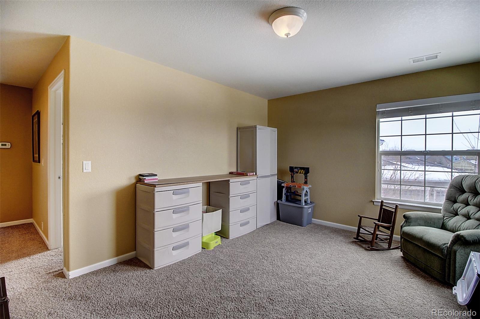 16330 Avalanche Run Broomfield, CO 80023 - Photo 39 of 39 a view of a livingroom with furniture and toys