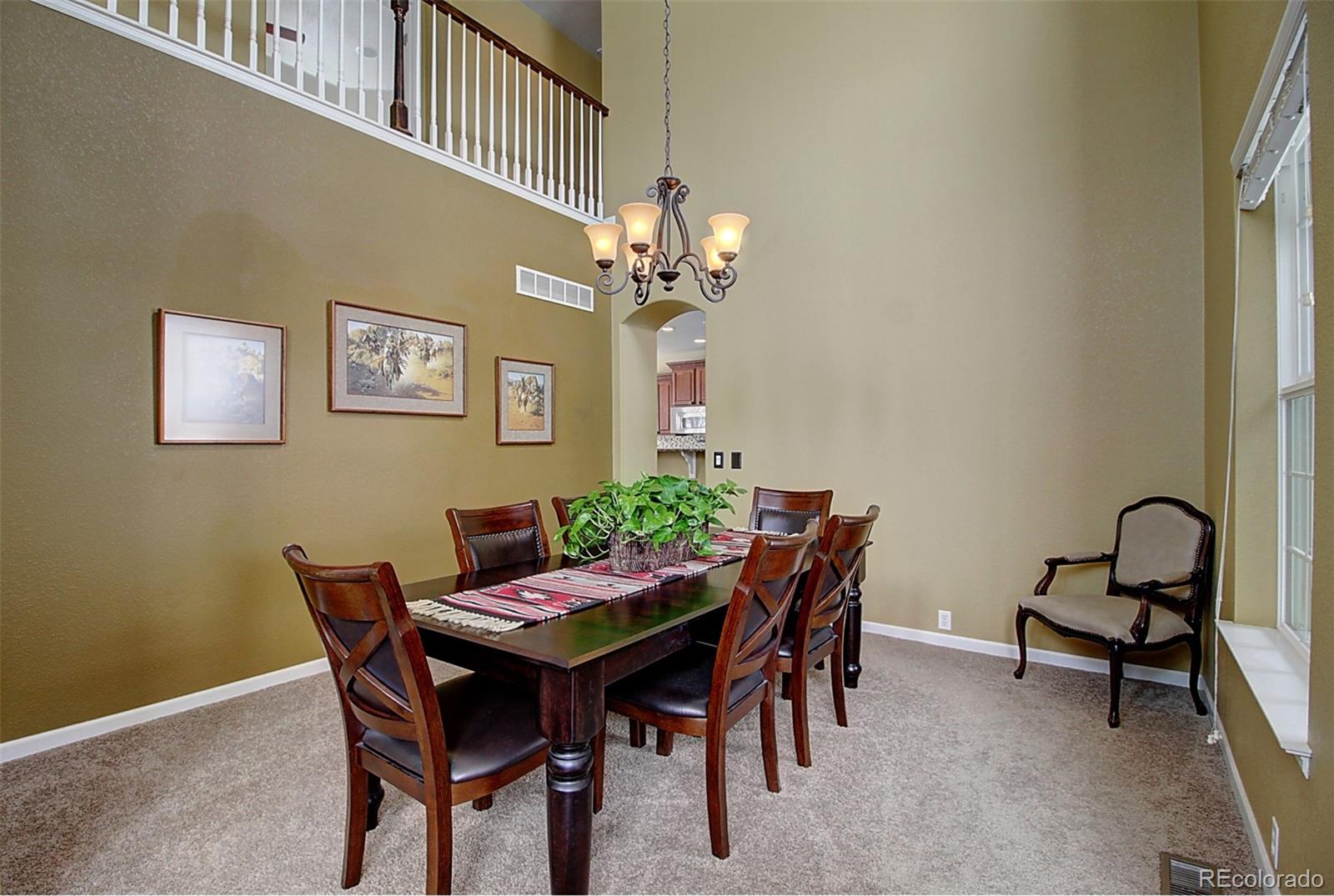 16330 Avalanche Run Broomfield, CO 80023 - Photo 4 of 39 a view of a dining room with furniture and a chandelier