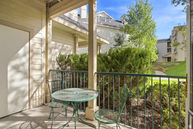 900 Bitner Road, Unit B14 Park City, UT 84098 - Photo 12 of 17 Private patio featuring a concrete surface, painted wood siding, and an iron railing