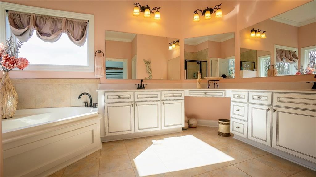 375 Old Plank Road Butler, PA 16002 - Photo 15 of 25 a bathroom with a sink a toilet and a bathtub