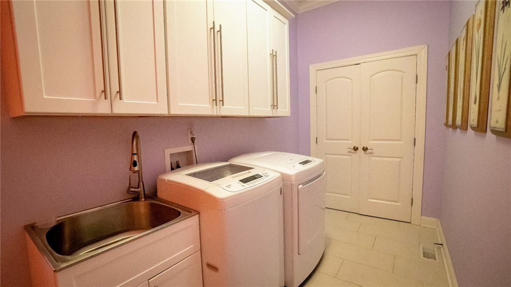 375 Old Plank Road Butler, PA 16002 - Photo 21 of 25 a utility room with dryer and washer