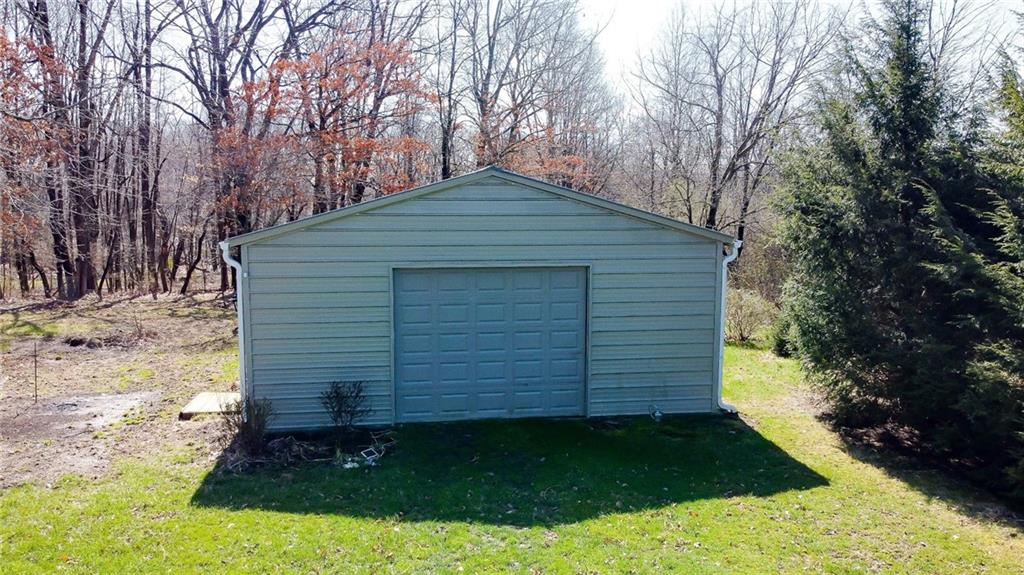 375 Old Plank Road Butler, PA 16002 - Photo 25 of 25 a backyard of a house with plants and large trees