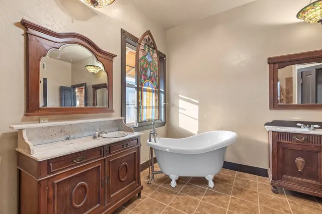 a kitchen with granite countertop a stove and a refrigerator