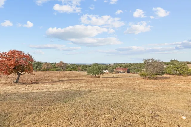 an aerial view of residential houses with city view