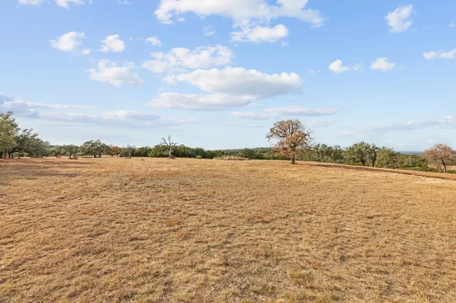 a view of a backyard of the house