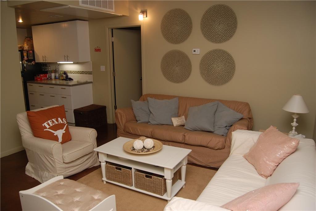 2408 Leon Street, Unit 215 Austin, TX 78705 - Photo 9 of 10 a living room with furniture and a lamp