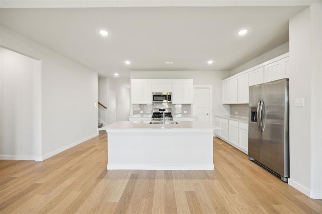 676 Poppy Lane Lavon, TX 75166 - Photo 3 of 35 Kitchen in the Masters home plan by Trophy Signature Homes – REPRESENTATIVE PHOTO
