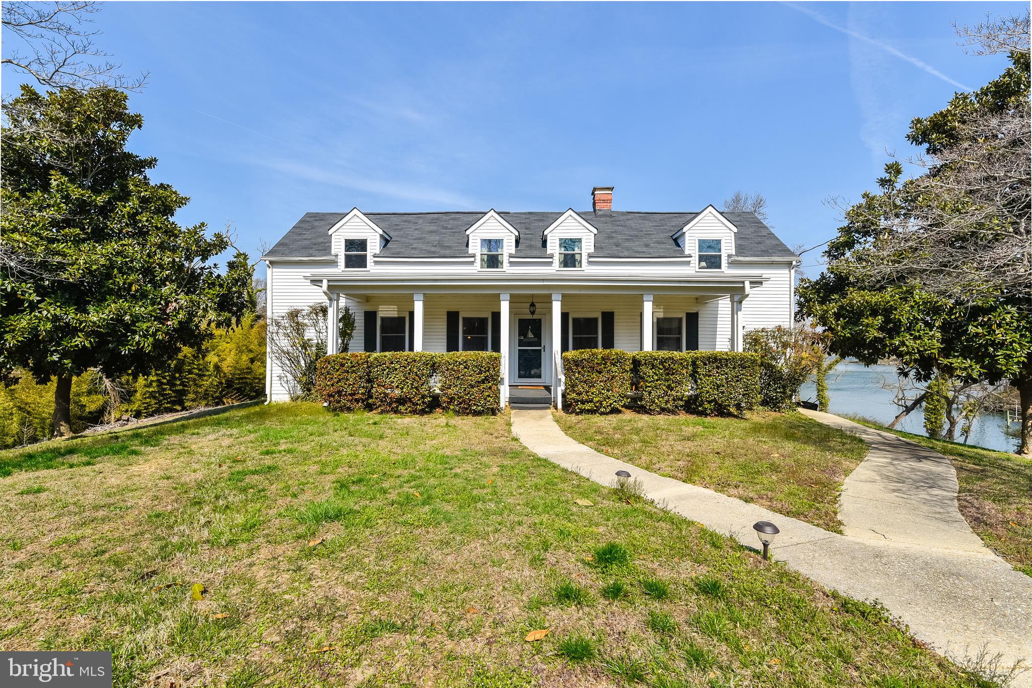 23690 West Patuxent Beach Road California, MD 20619 - Photo 1 of 39 a view of a yard in front of house