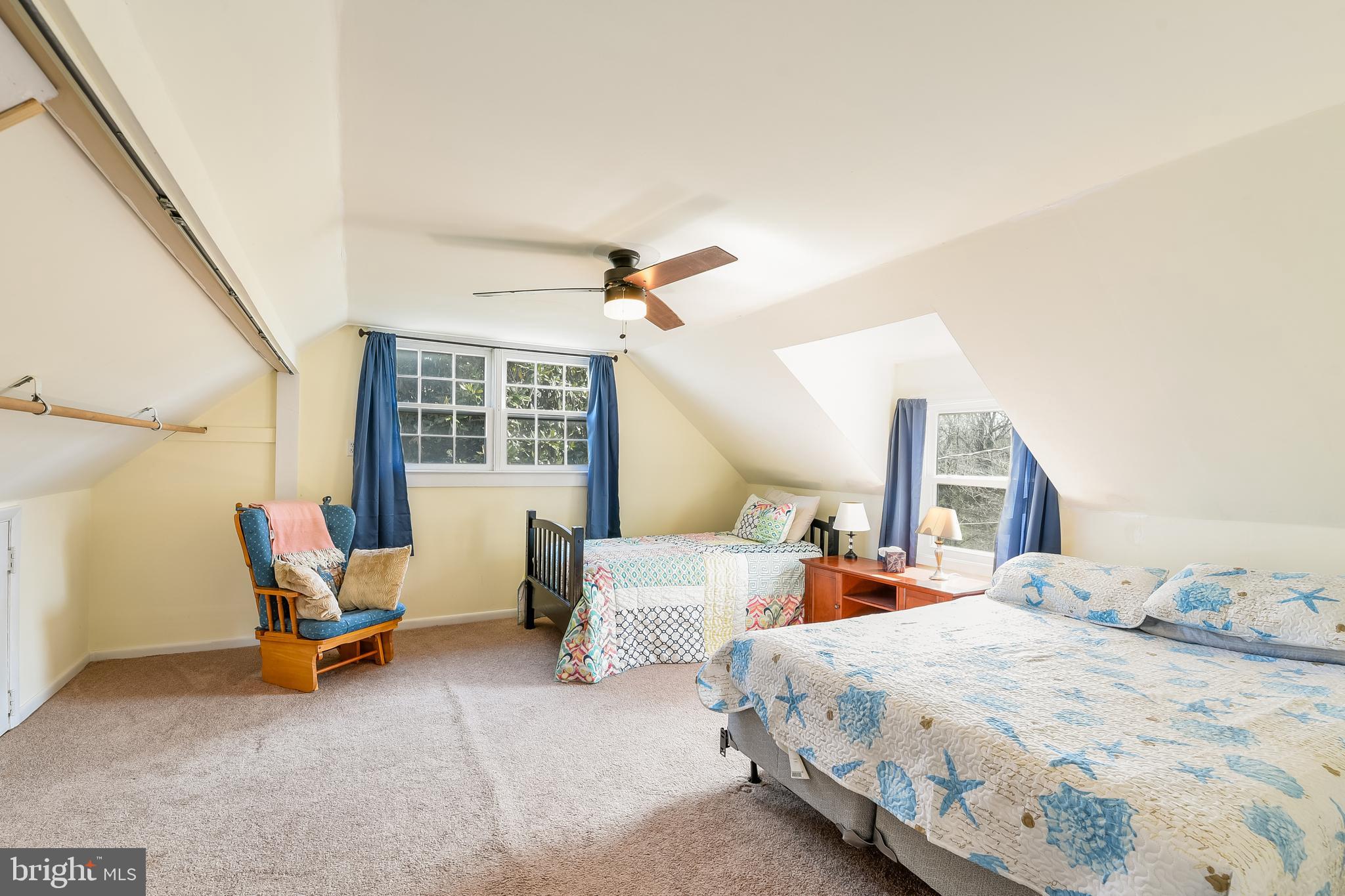 23690 West Patuxent Beach Road California, MD 20619 - Photo 16 of 39 a bedroom with two beds and a large window