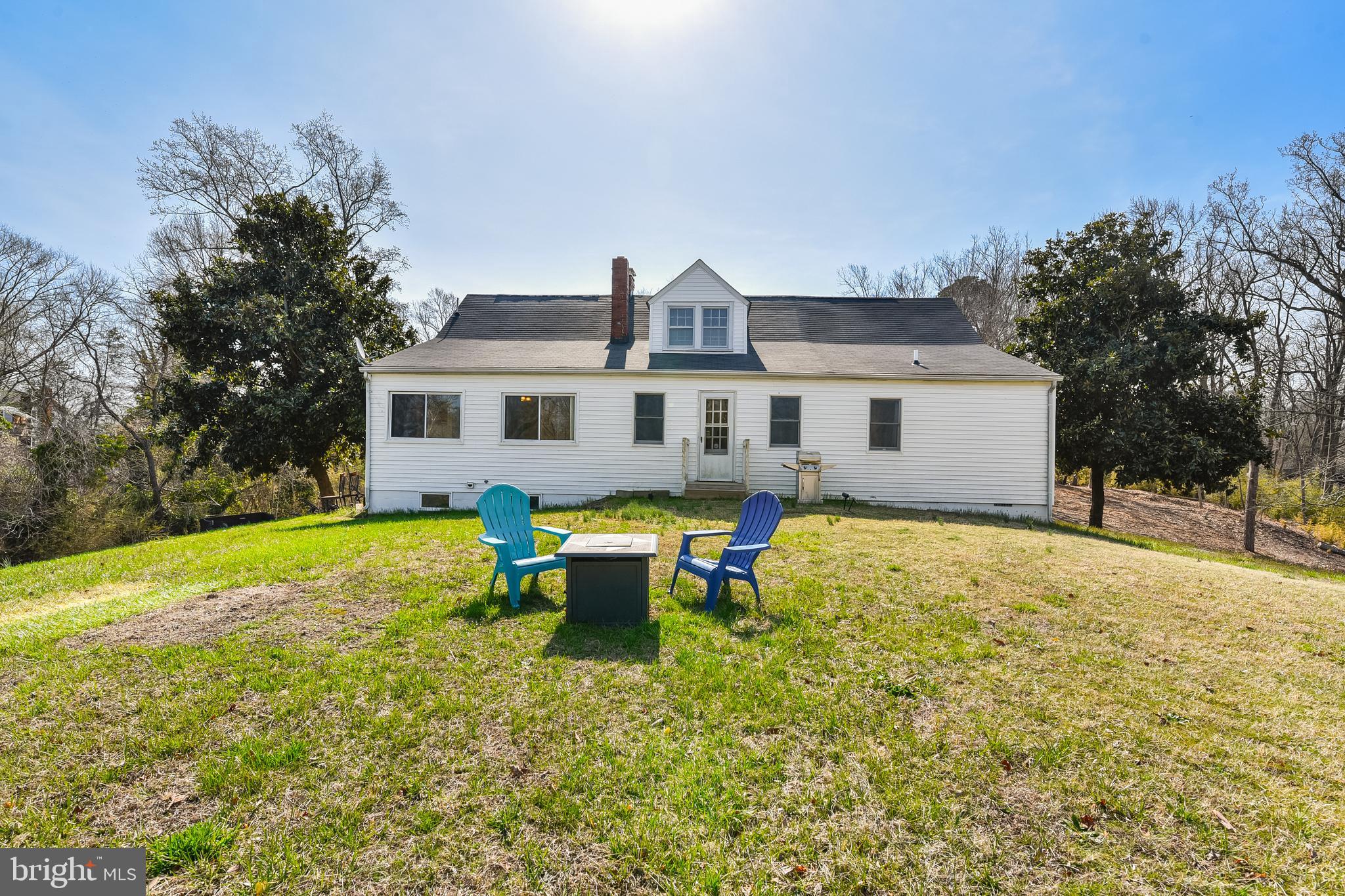 23690 West Patuxent Beach Road California, MD 20619 - Photo 19 of 39 a view of a house with pool and a yard