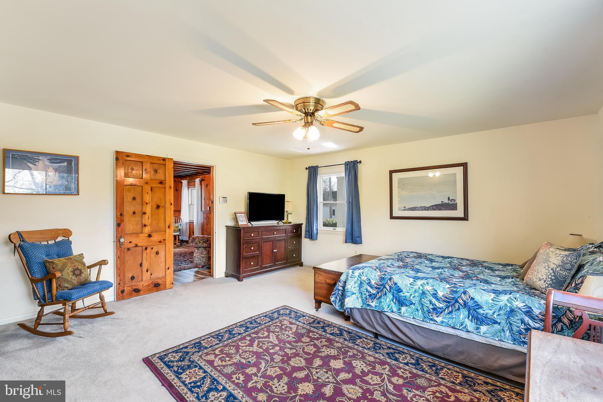 23690 West Patuxent Beach Road California, MD 20619 - Photo 33 of 39 a bedroom with furniture and a flat screen tv
