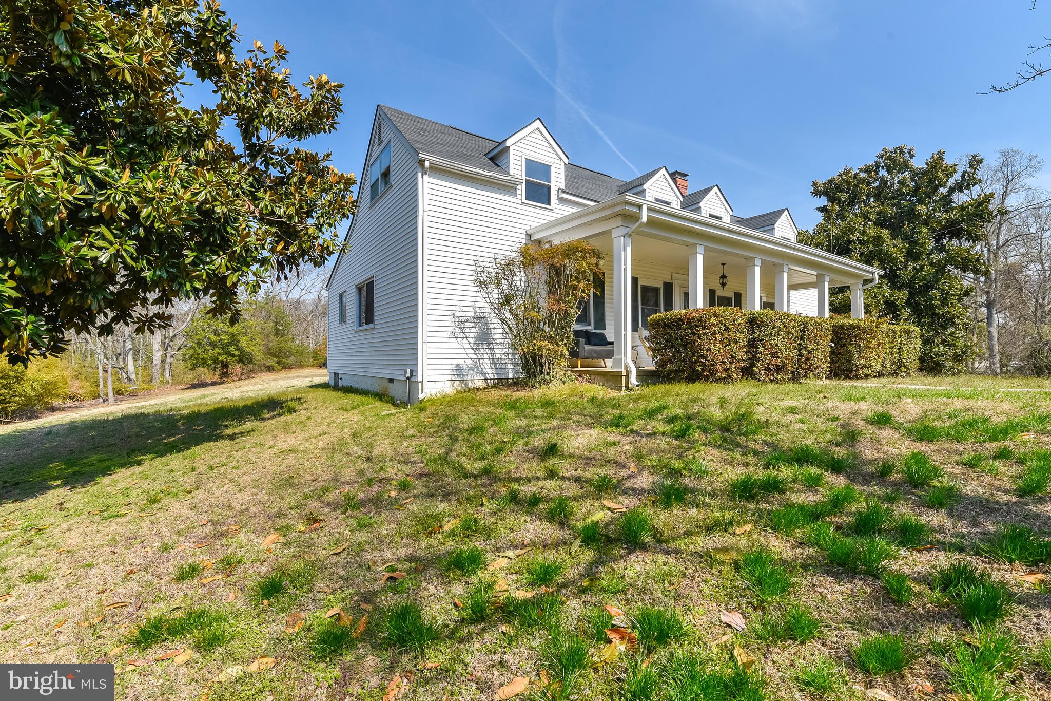 23690 West Patuxent Beach Road California, MD 20619 - Photo 9 of 39 a front view of a house with a yard