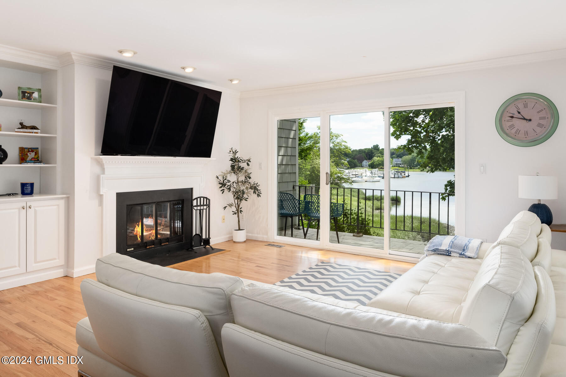 a living room with furniture fireplace and a flat screen tv