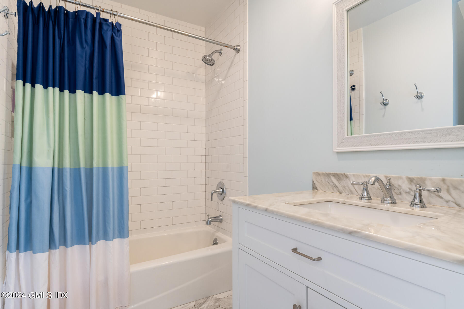 100 Strickland Road, Unit 10 Cos Cob, CT 06807 - Photo 12 of 26 a bathroom with a granite countertop sink and a bathtub