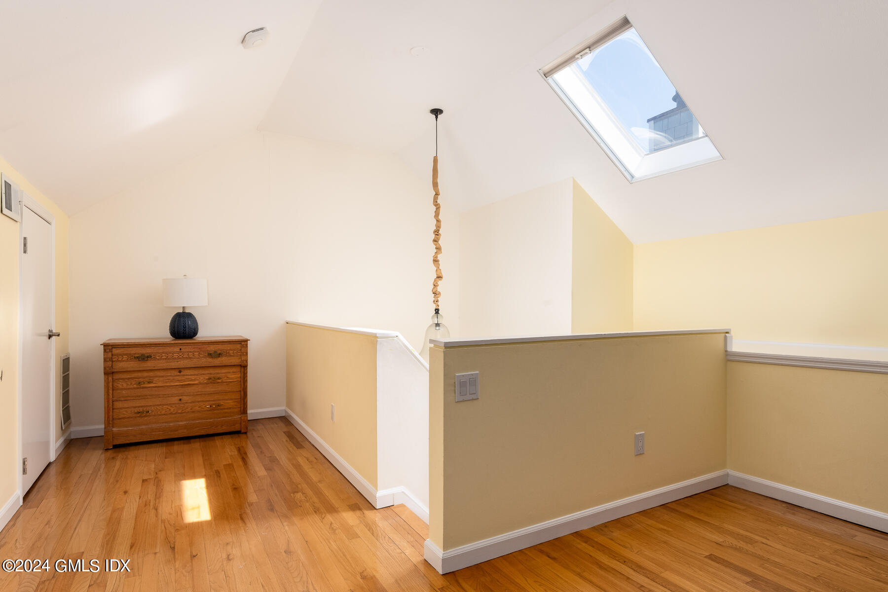 100 Strickland Road, Unit 10 Cos Cob, CT 06807 - Photo 13 of 26 a view of a room with furniture and wooden floor