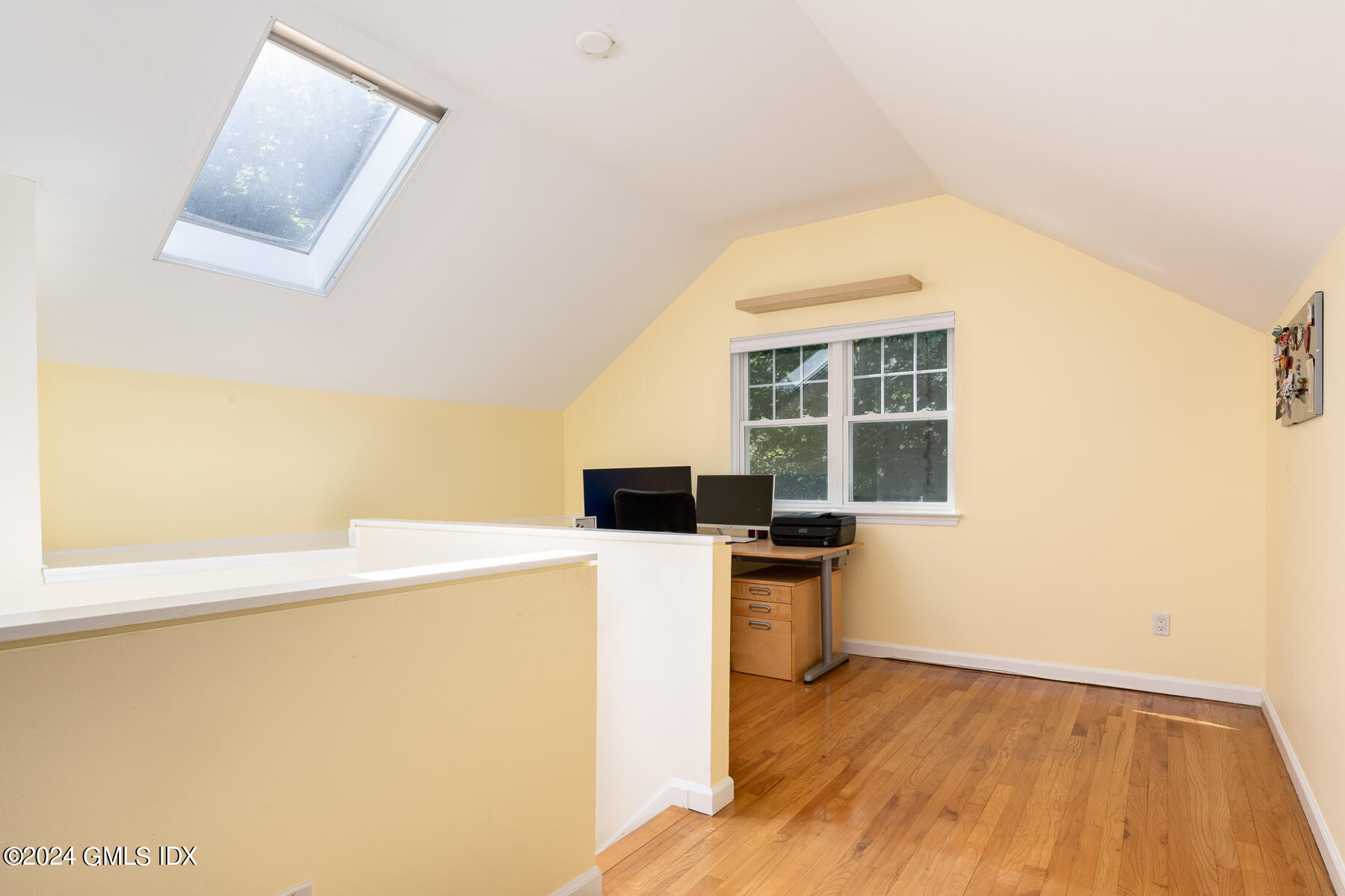 100 Strickland Road, Unit 10 Cos Cob, CT 06807 - Photo 14 of 26 a view of a kitchen with a fridge and wooden floor