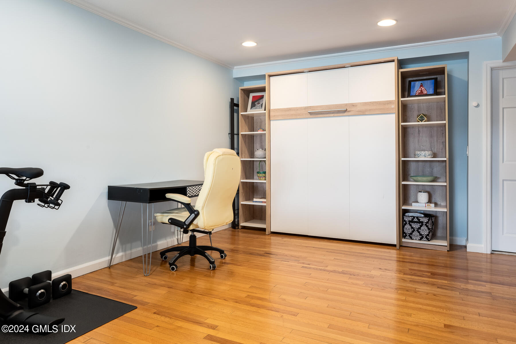 100 Strickland Road, Unit 10 Cos Cob, CT 06807 - Photo 15 of 26 a view of a workspace with furniture and a wooden floor
