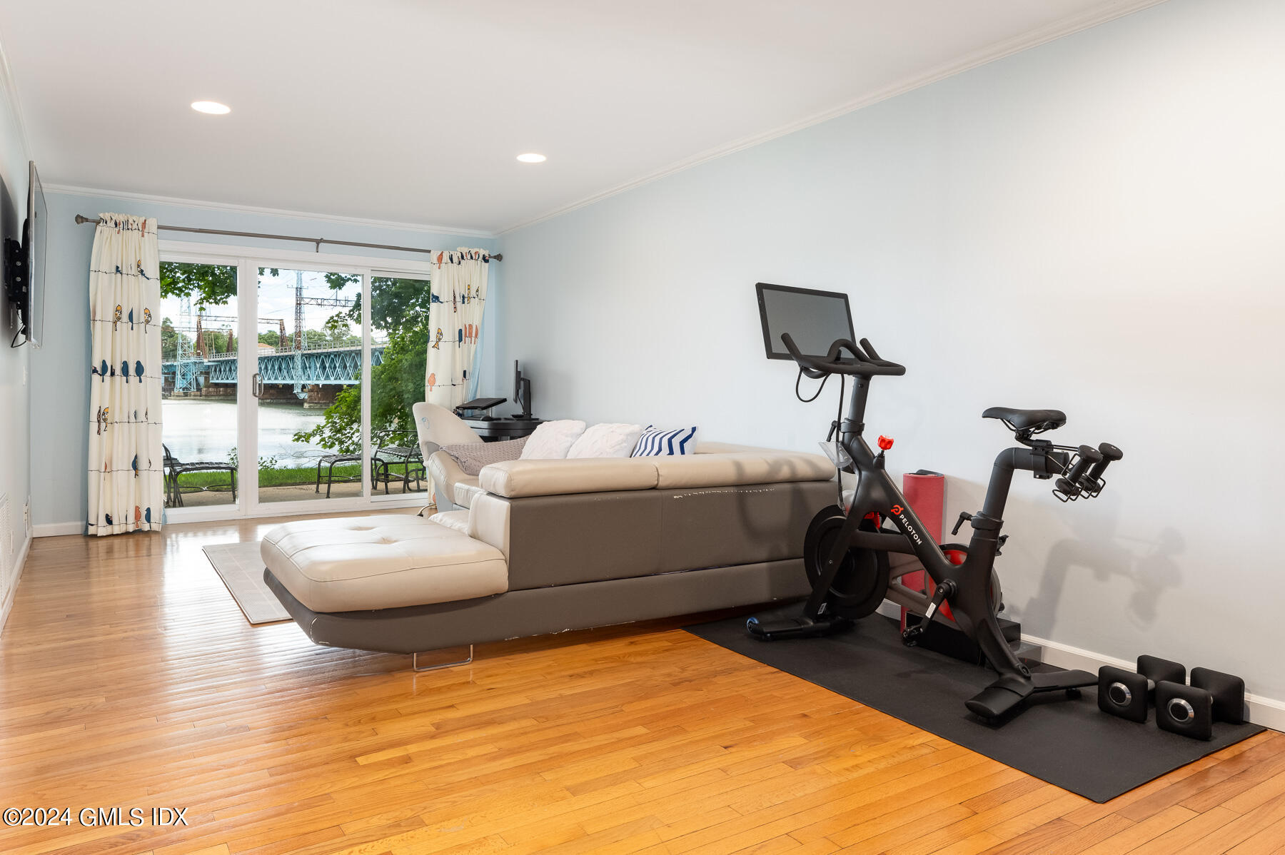 100 Strickland Road, Unit 10 Cos Cob, CT 06807 - Photo 16 of 26 a room with gym equipment and a large window