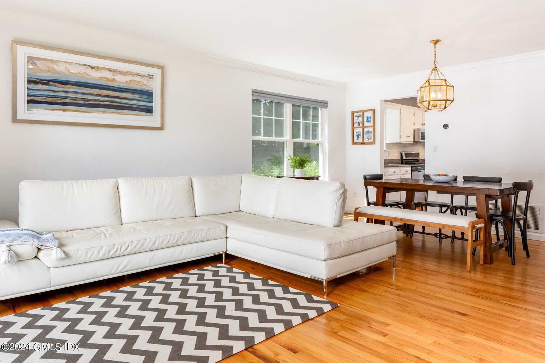 100 Strickland Road, Unit 10 Cos Cob, CT 06807 - Photo 3 of 26 a living room with furniture and wooden floor