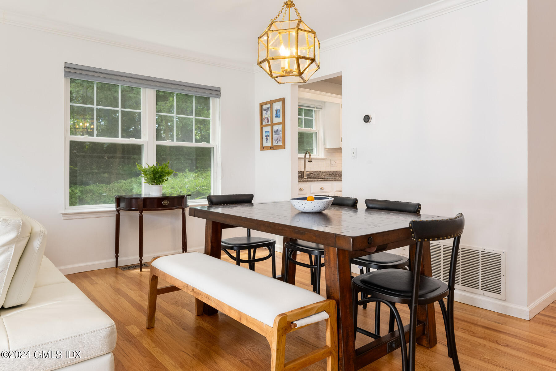 100 Strickland Road, Unit 10 Cos Cob, CT 06807 - Photo 4 of 26 a view of a dining room with furniture window and wooden floor
