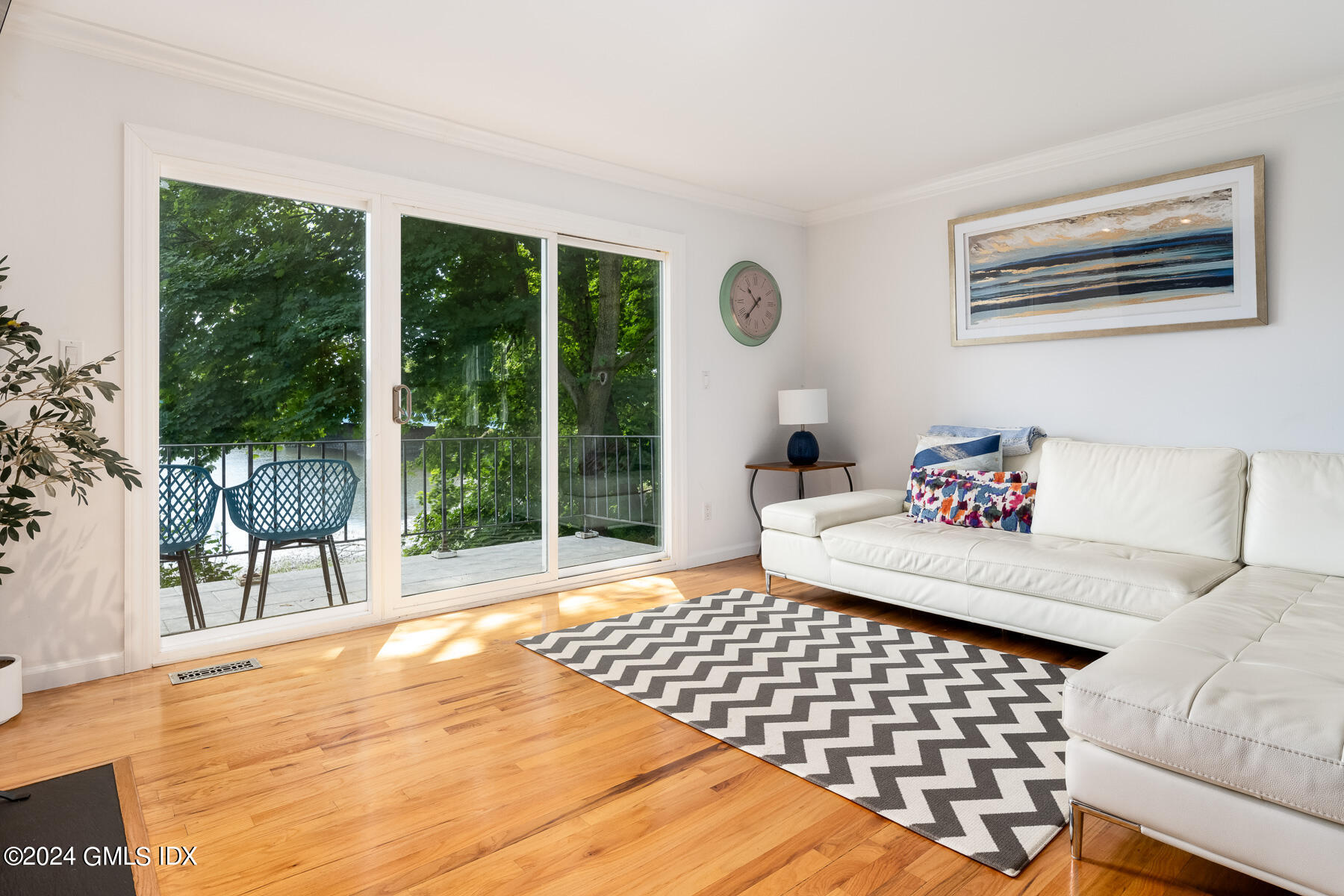 100 Strickland Road, Unit 10 Cos Cob, CT 06807 - Photo 5 of 26 a bedroom with a bed and a large window