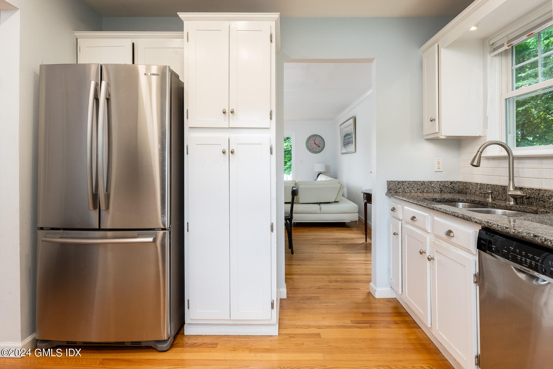 100 Strickland Road, Unit 10 Cos Cob, CT 06807 - Photo 7 of 26 a kitchen with stainless steel appliances granite countertop a refrigerator and a stove