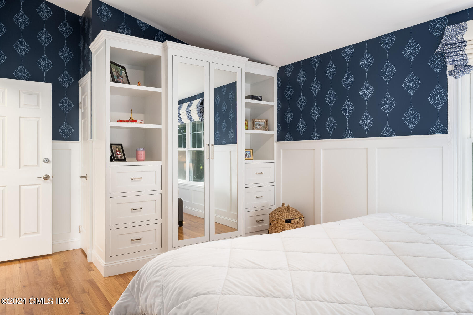 100 Strickland Road, Unit 10 Cos Cob, CT 06807 - Photo 9 of 26 a bedroom with a bed and closet