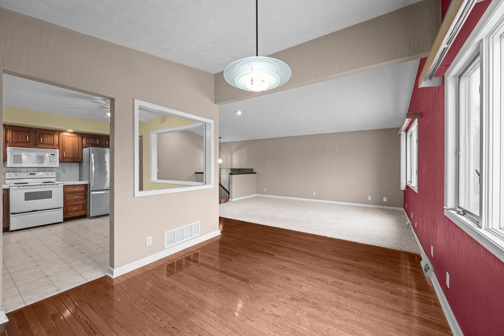 1141 Mark Street Colona, IL 61241 - Photo 11 of 29 a view of a kitchen with a stove cabinets and wooden floor