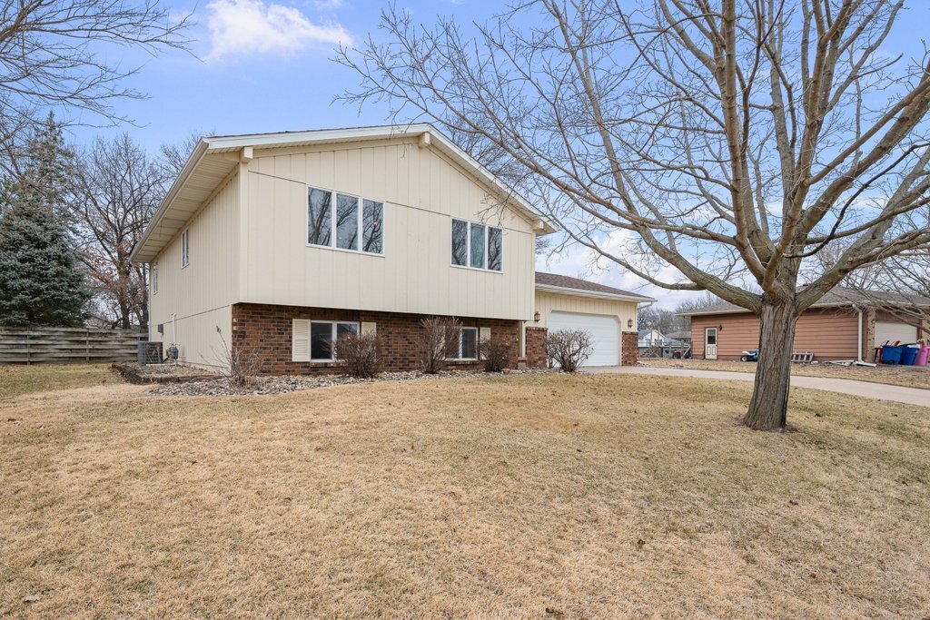 1141 Mark Street Colona, IL 61241 - Photo 2 of 29 a front view of a house with a yard and garage