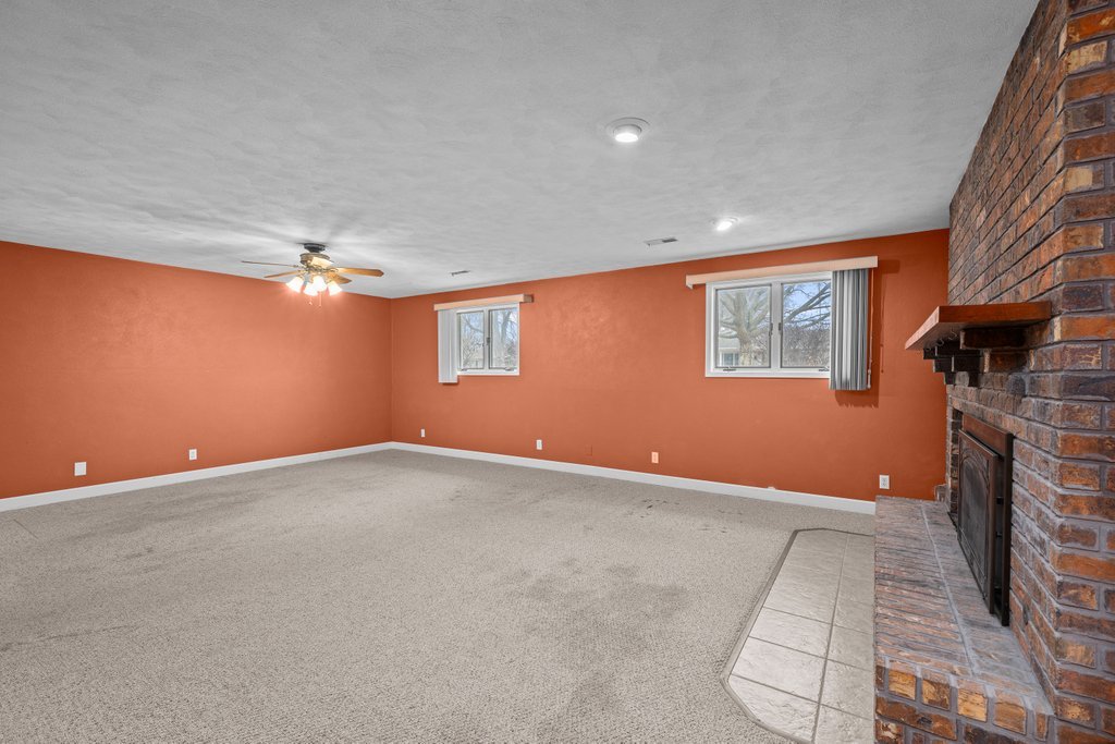 1141 Mark Street Colona, IL 61241 - Photo 23 of 29 a view of an empty room with a fireplace