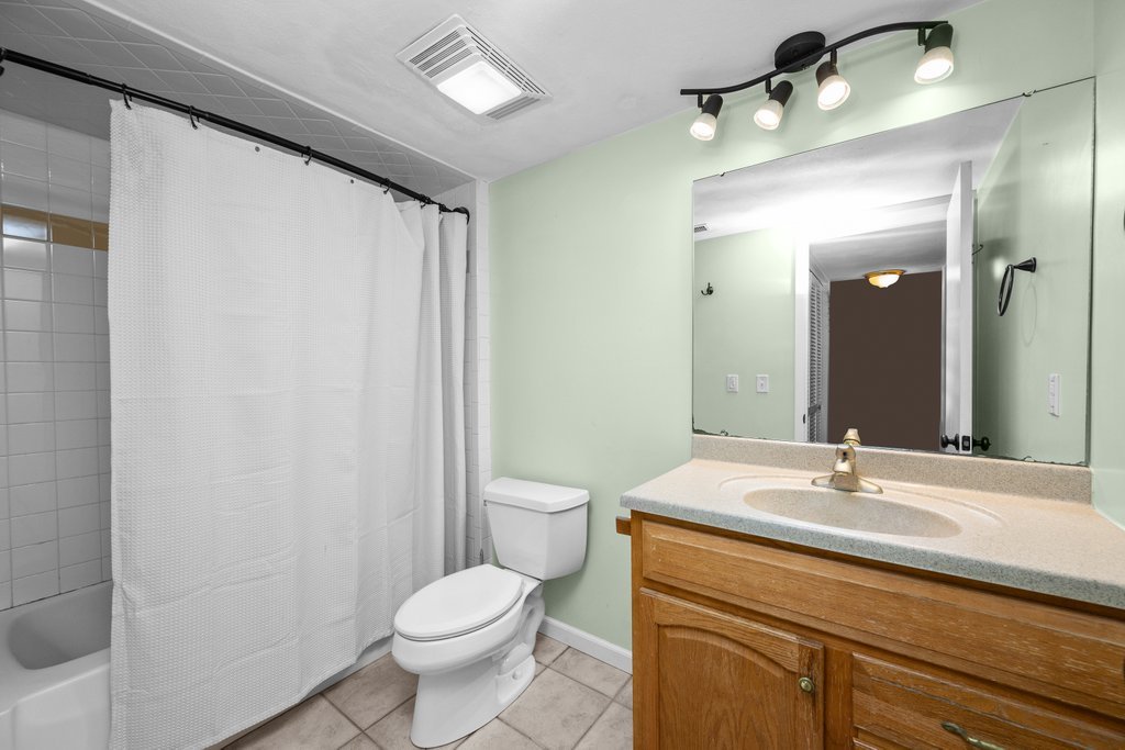 1141 Mark Street Colona, IL 61241 - Photo 26 of 29 a bathroom with a sink a toilet and shower