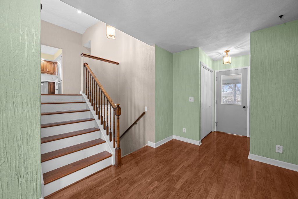 1141 Mark Street Colona, IL 61241 - Photo 5 of 29 a view of a room with wooden floor and entryway